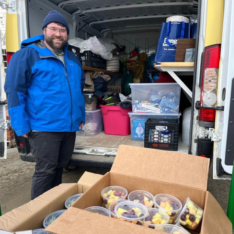 Will Matteson loads a van for HLC’s mobile outreach program. Courtesy photo