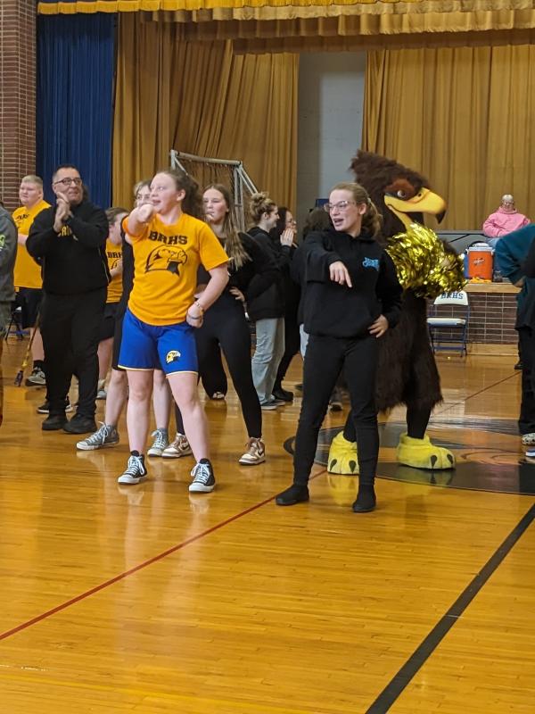 Suzie Edwards, Hannah Hills and Ella Watts lead a halftime Y-M-C-A dance. CANDI JONETH/Boothbay Register