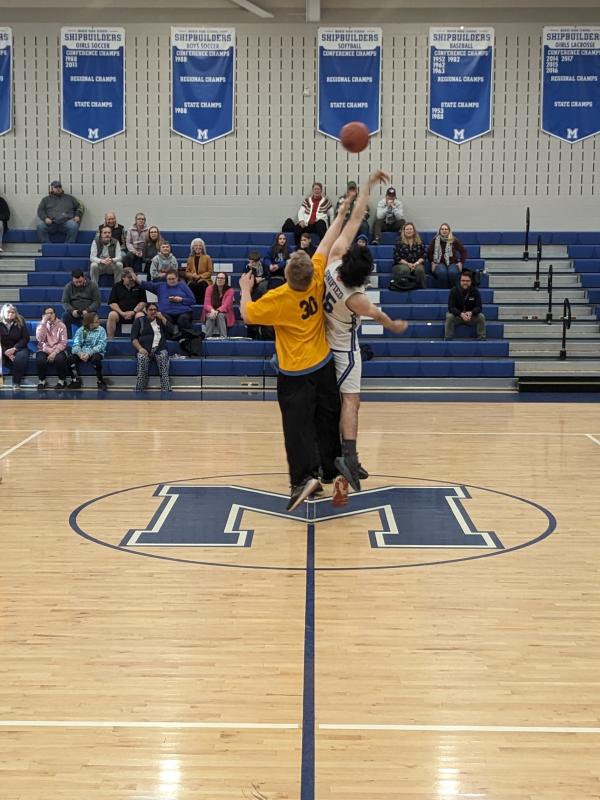 Austin Orne and Sam Lambert tip off the Seahawks vs. Shipbuilders March 12 game at Morse High School. CANDI JONETH/Boothbay Register