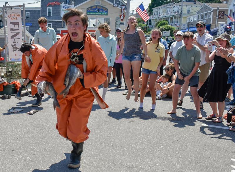 A racer cries out at the starting line as his team cheers him on during the Windjammer Days Cod Fish Races June 26. FRITZ FREUDENBERGER/Boothbay Register