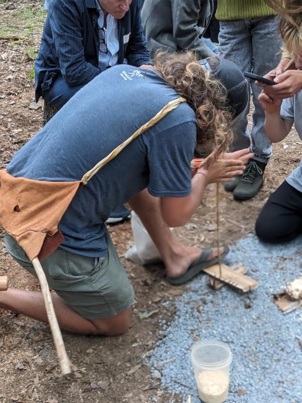 Josh Leatham demonstrates fire-starting by bow drilling. CANDI JONETH/Boothbay Register Event