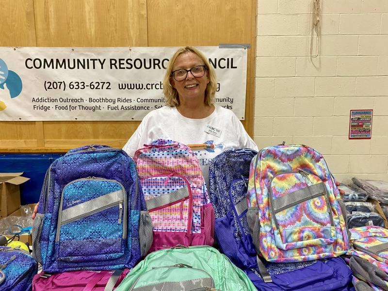 Holly Stover helps hand out free backpacks to students. ISABELLE CURTIS/Boothbay Register