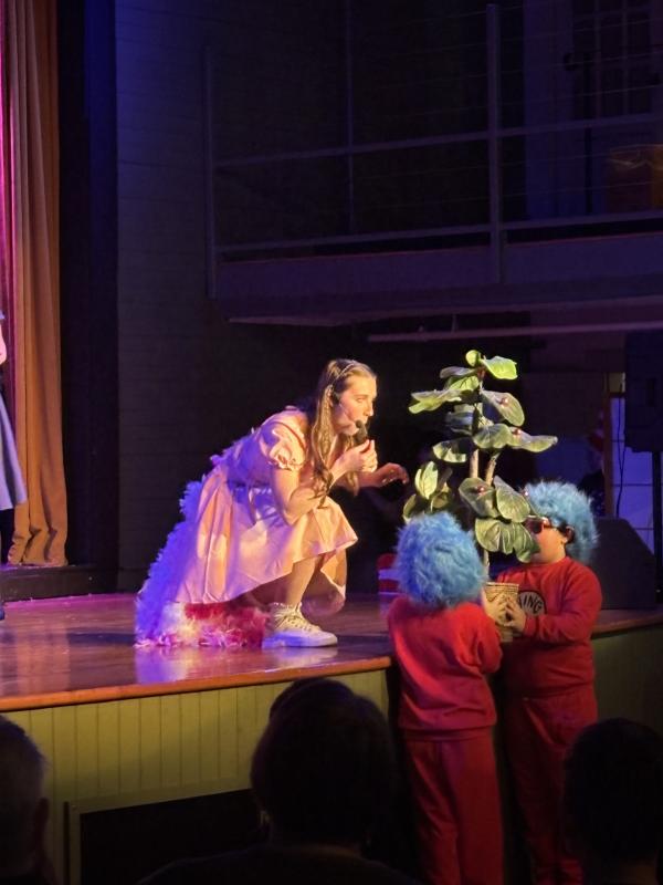 Gertrude (Taylor Fish) nibbling on a pill-berry bush. LISA KRISTOFF/Boothbay Register Seussical. LISA KRISTOFF/Boothbay Register