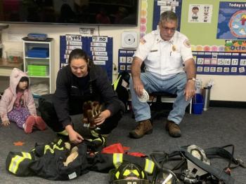 Lt. Chantelle Arsenault begins her equipment demonstration Oct. 11 during a Boothbay-Boothbay Harbor fire safety visit to BRES. BILL PEARSON/Boothbay Register