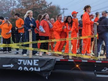 The BRHS senior class sports orange jumpers for the seniors’ “prison break” theme in the Homecoming parade. CANDI JONETH/Boothbay Register