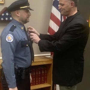 Doug Snyder, left, receives his chief’s pin from former chief Bob Hasch Feb. 17 during a ceremony in the town office’s conference room. BILL PEARSON/Boothbay Register