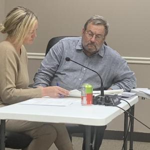 Boothbay Harbor Selectmen Alyssa Allen, left, and Ken Rayle review a municipal audit report during the April 10 meeting. BILL PEARSON/Boothbay Register