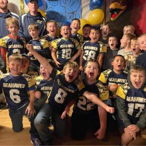 2nd Annual Mini Seahawks Pep Rally, Friday at 5pm football, kids eat free,